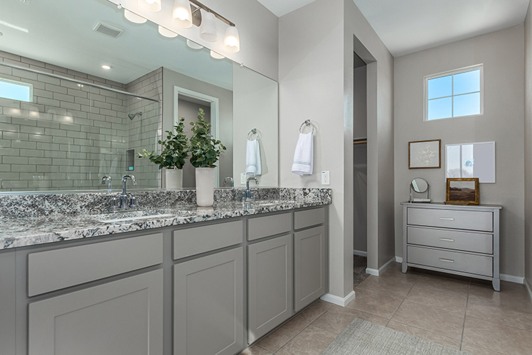 A bathroom with a large mirror.