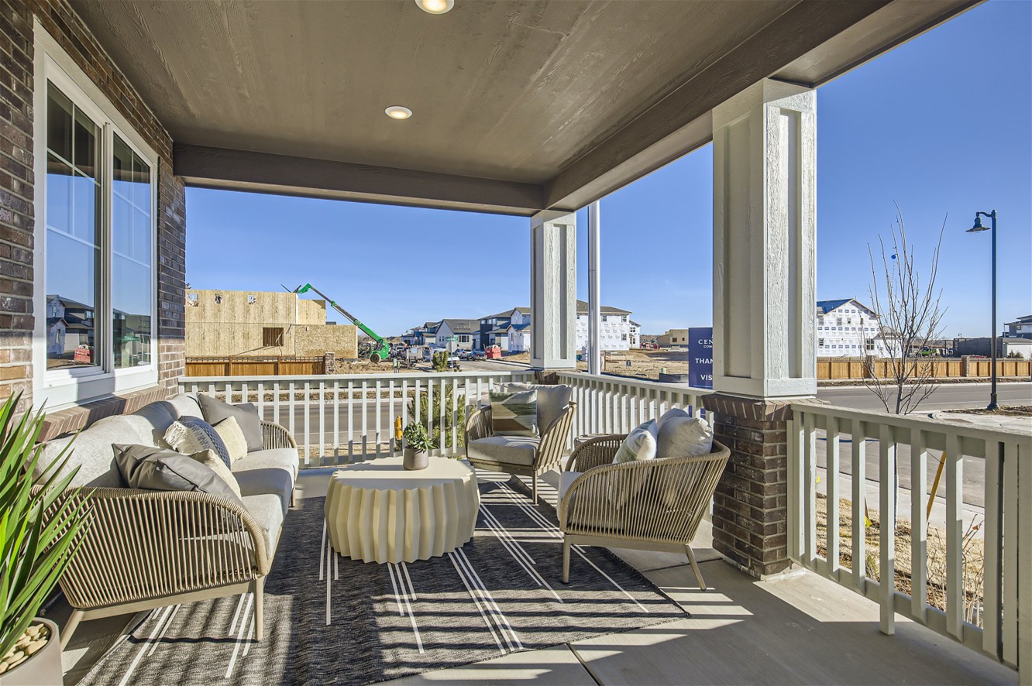 A patio with a table and chairs.