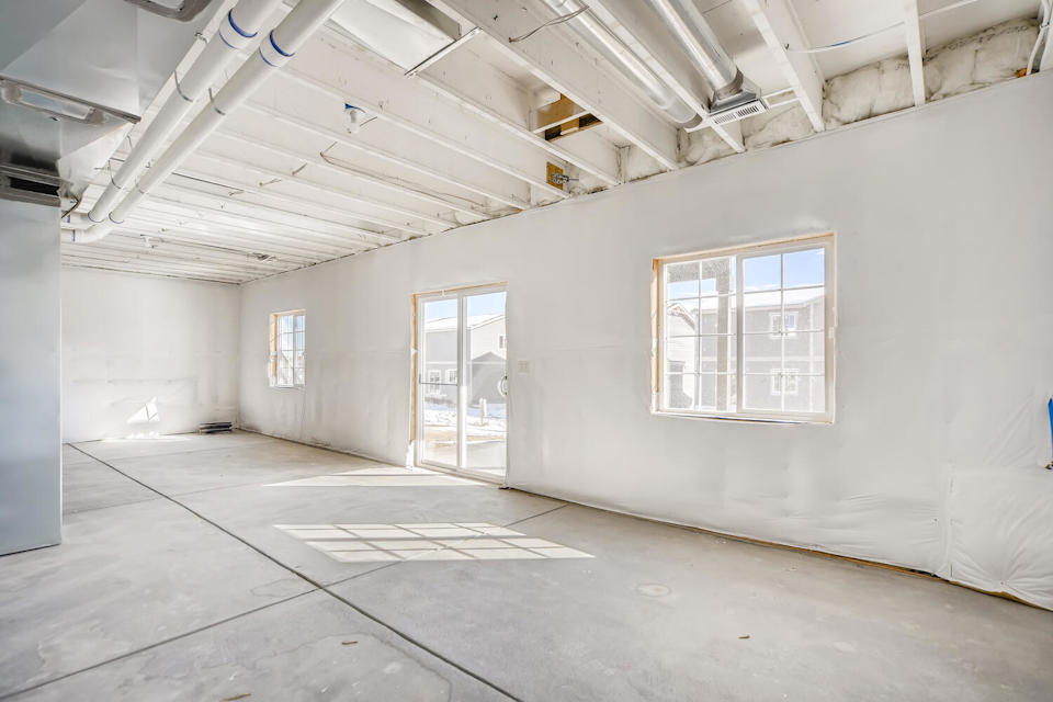 A room with a door and windows.