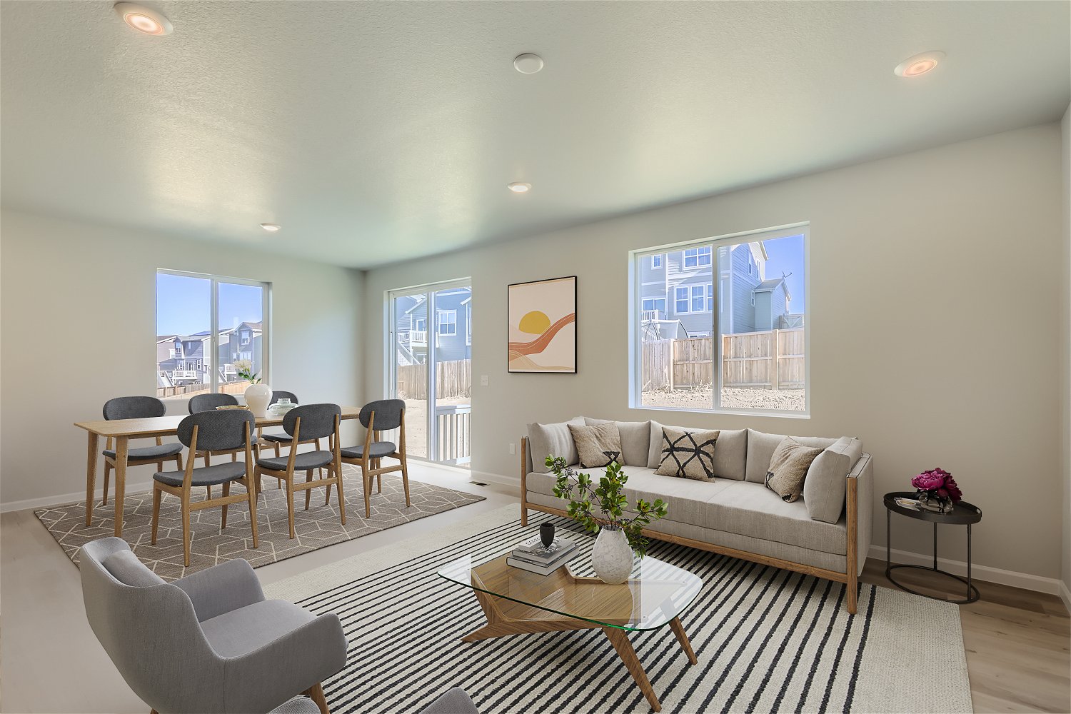 A living room with a couch and chairs.