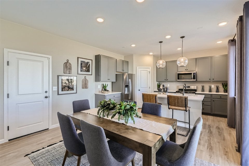 A kitchen with a dining table.