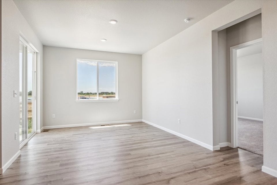 A room with a wood floor and a wood floor.