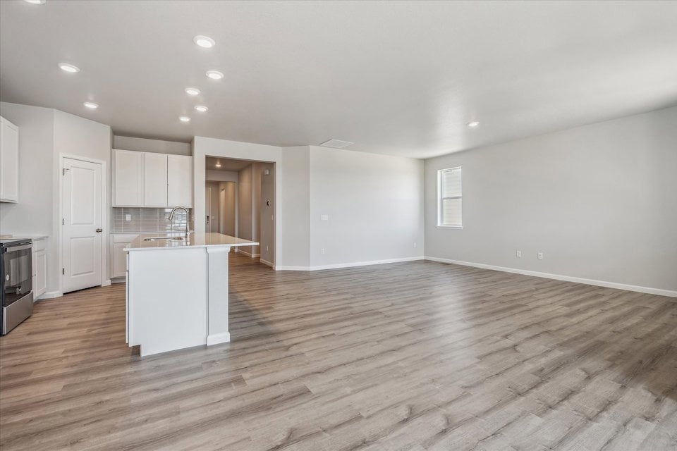 A large kitchen with white cabinets.