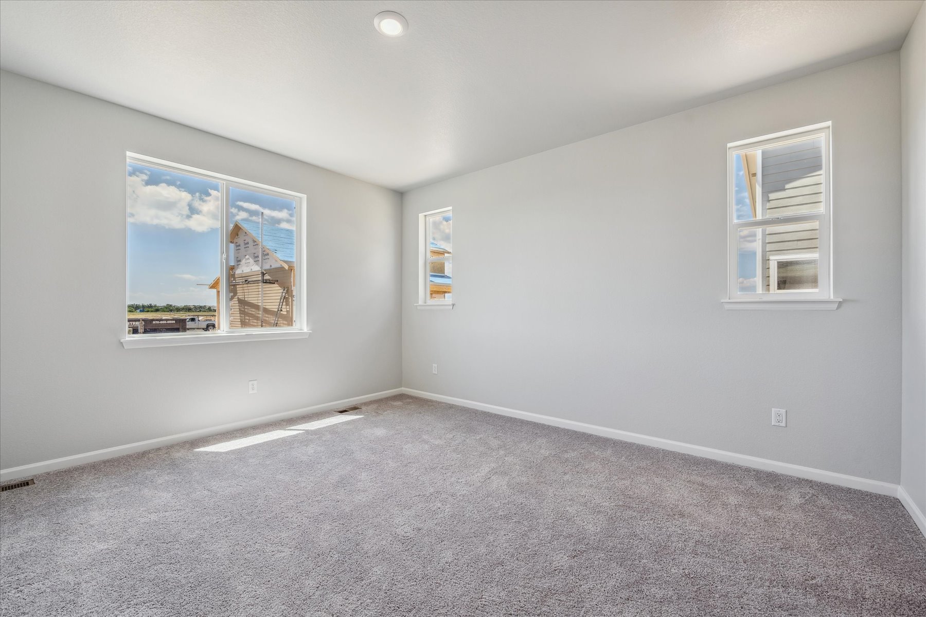 A room with a few paintings on the wall.