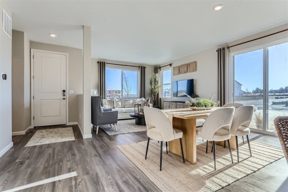 A dining room with a large window.