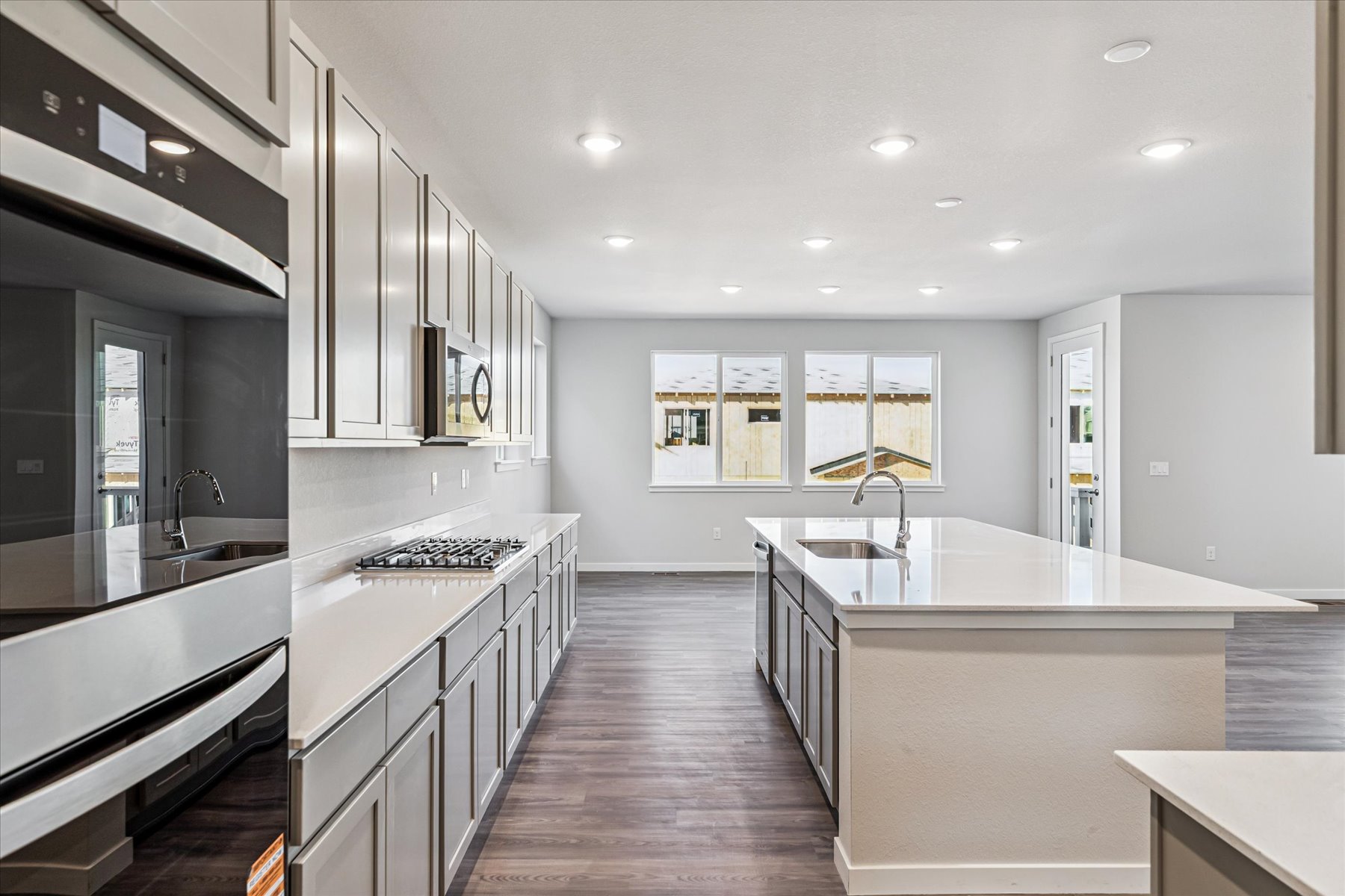 A kitchen with black cabinets.