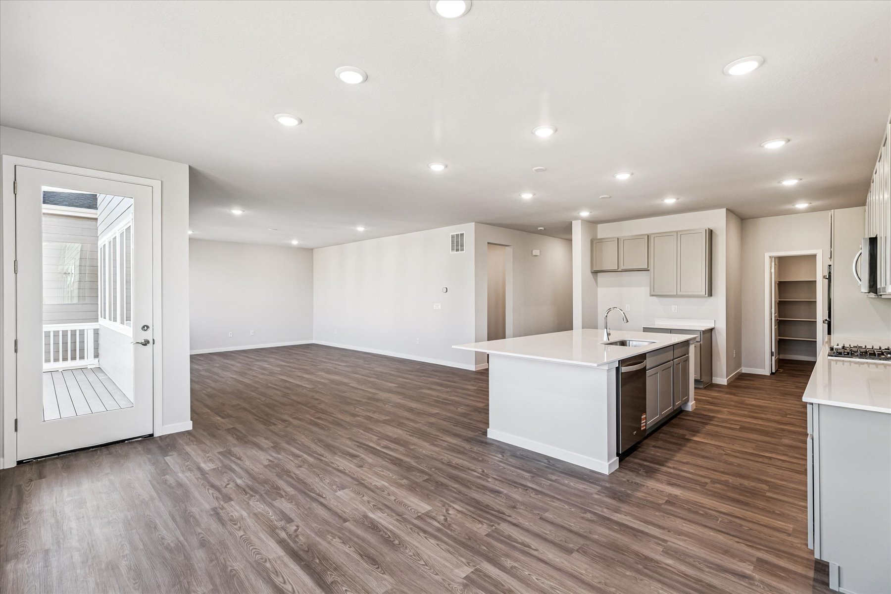 A large kitchen with white cabinets.