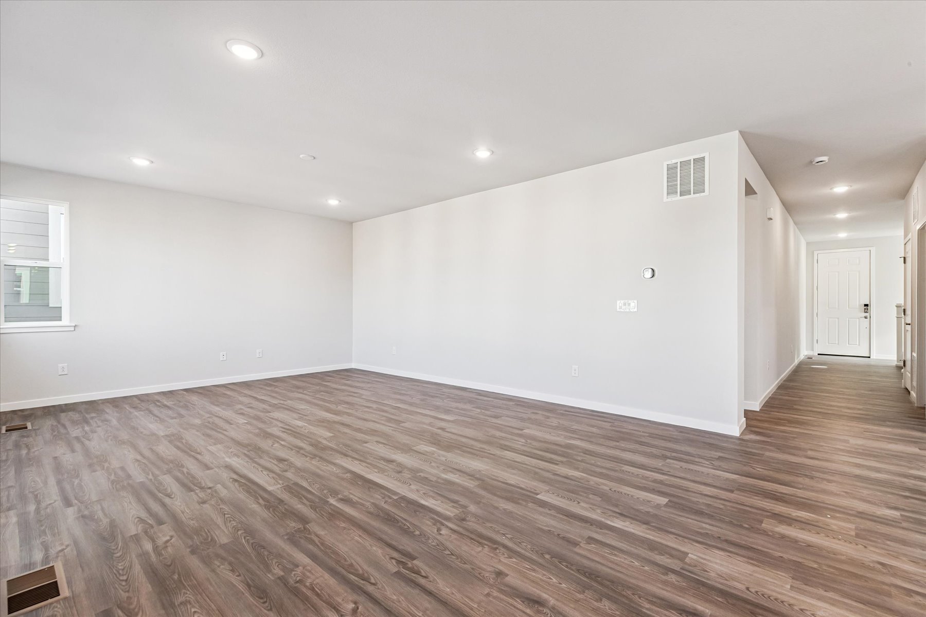 A room with a wood floor and a wood floor.
