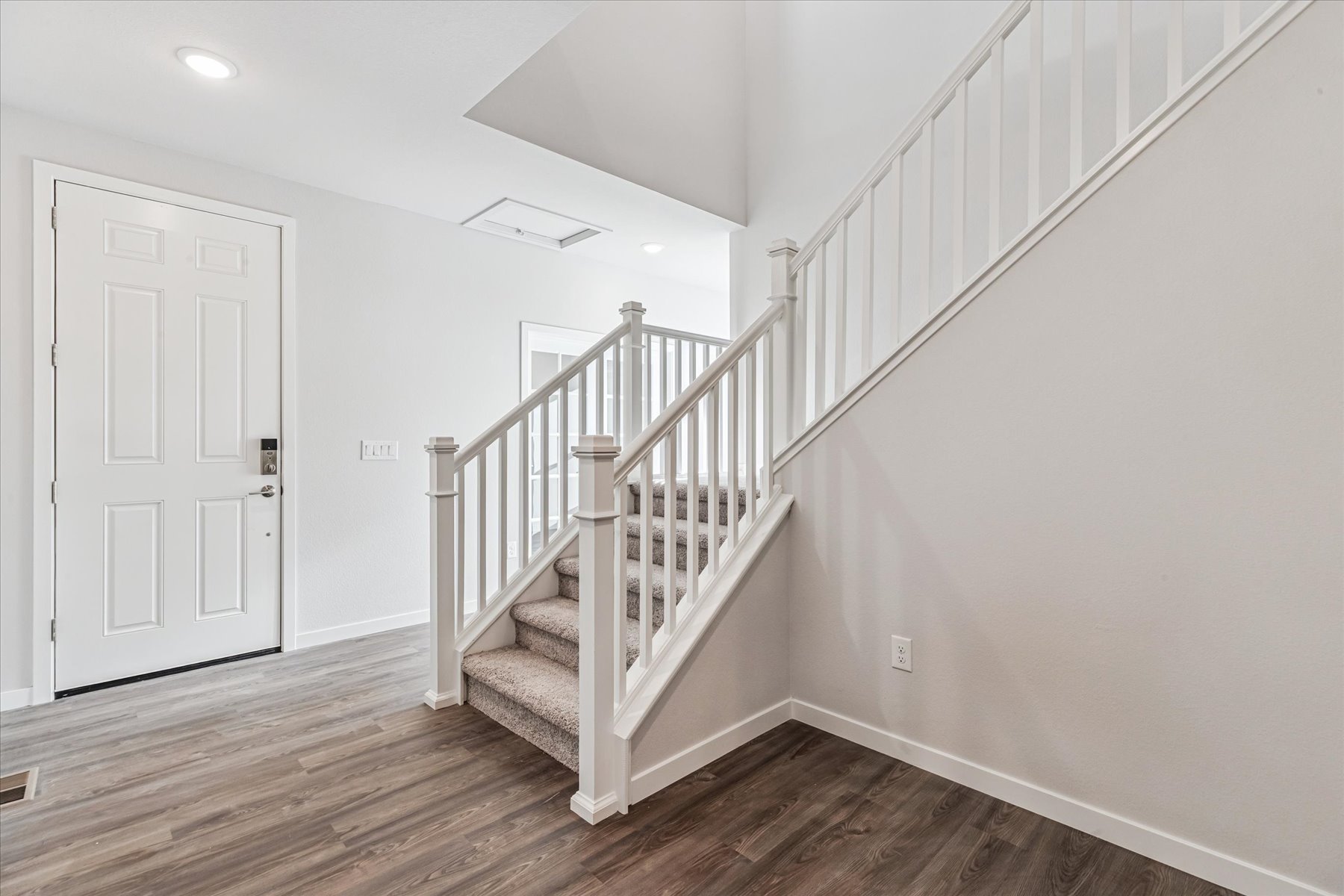 A white staircase in a house.