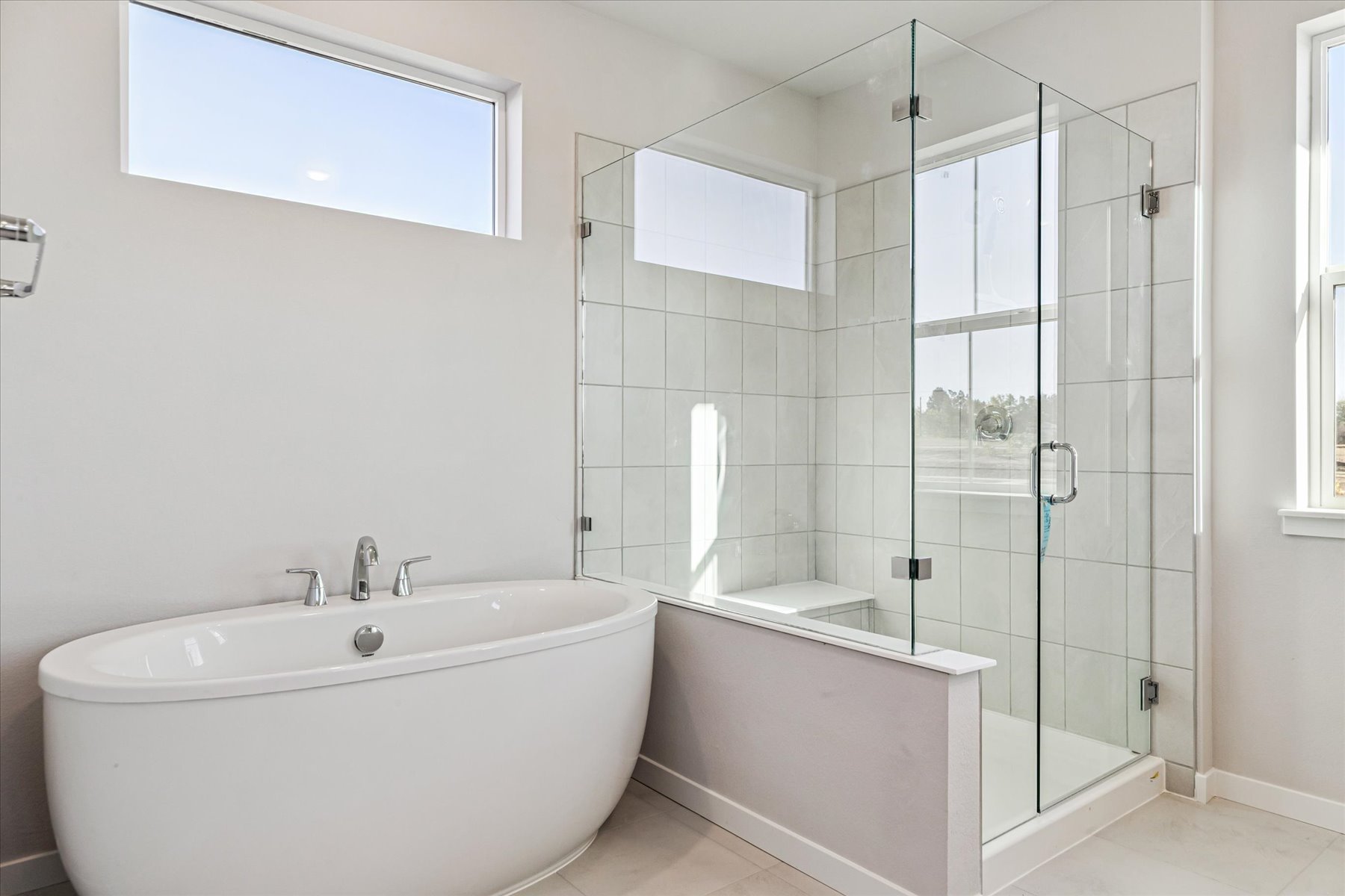 A bathroom with a glass shower.