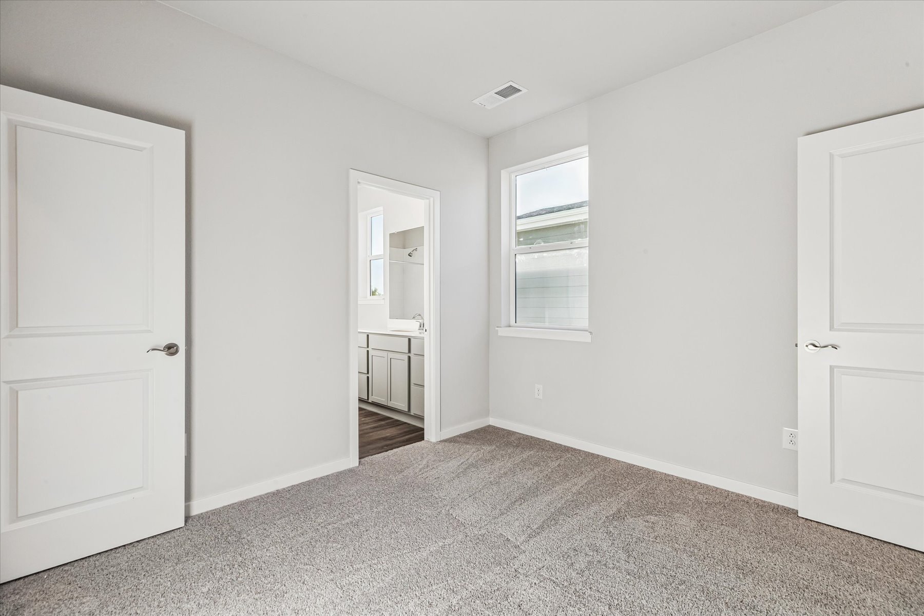 A room with white doors.