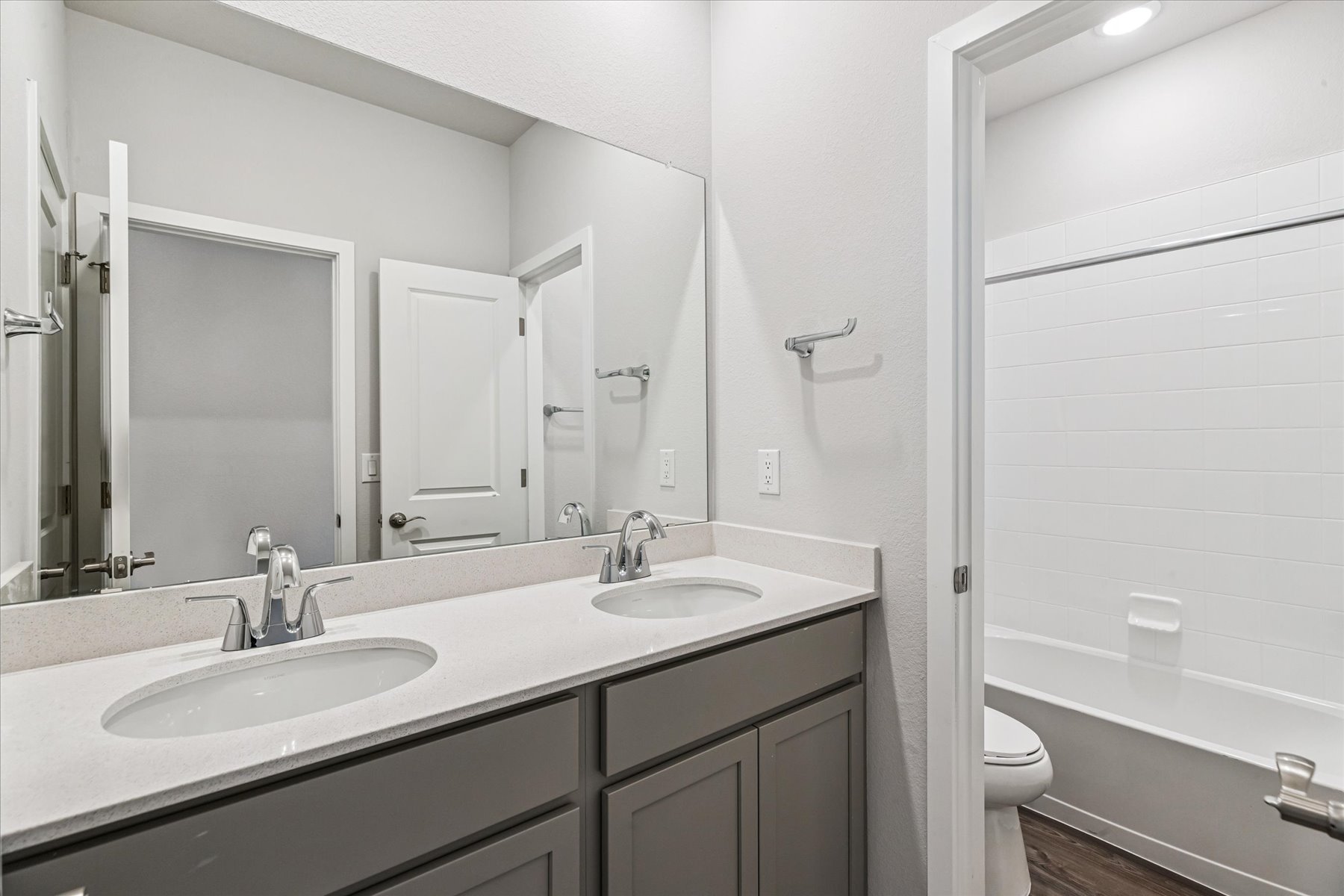 A bathroom with a sink and a toilet.