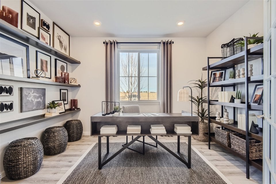 A room with a table and shelves.