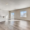 Great room and kitchen of the ranch style Palisade plan by Century Communities