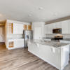 Open concept kitchen of the ranch style Palisade plan by Century Communities