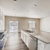 Kitchen and informal dining room of the ranch style Palisade plan by Century Communities