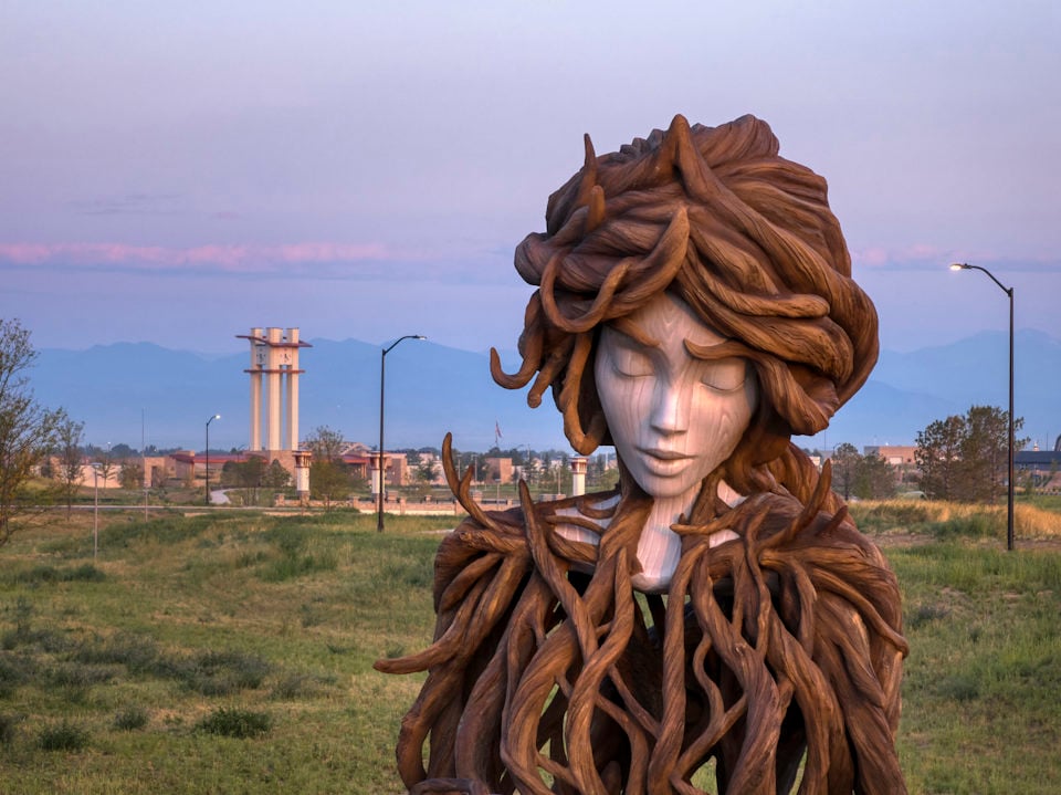 A statue of a person with a large head.