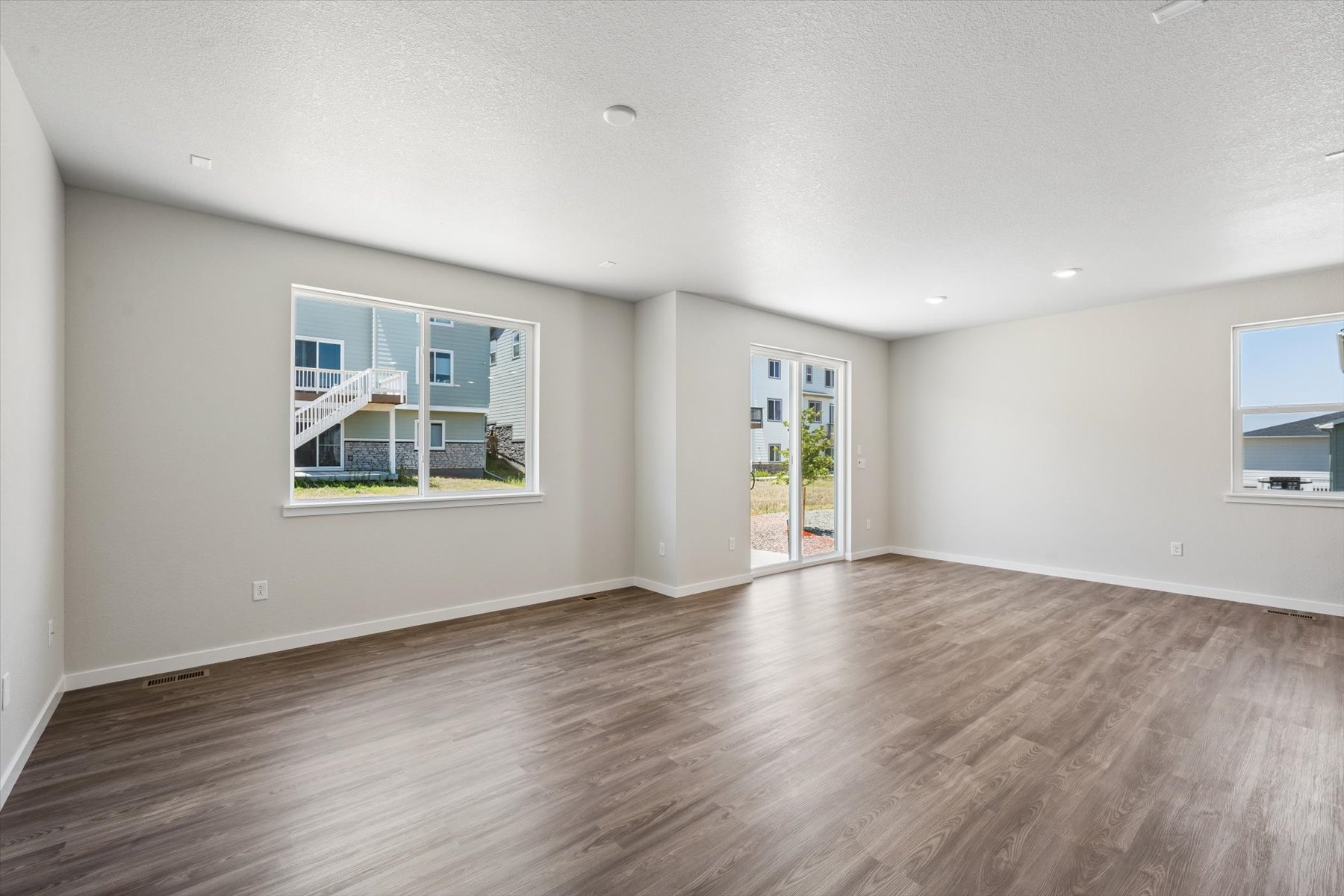 A room with a wood floor and a wood floor.