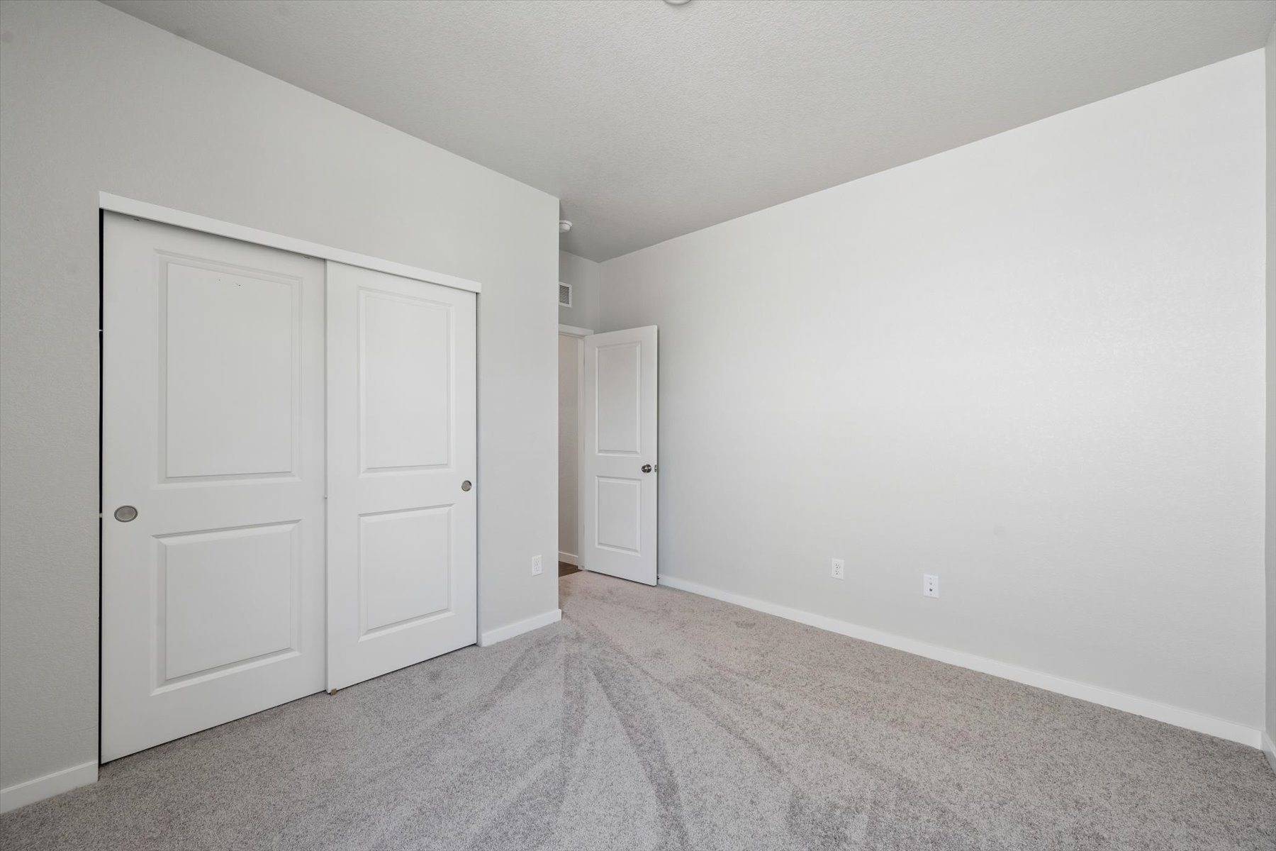 A room with white doors.