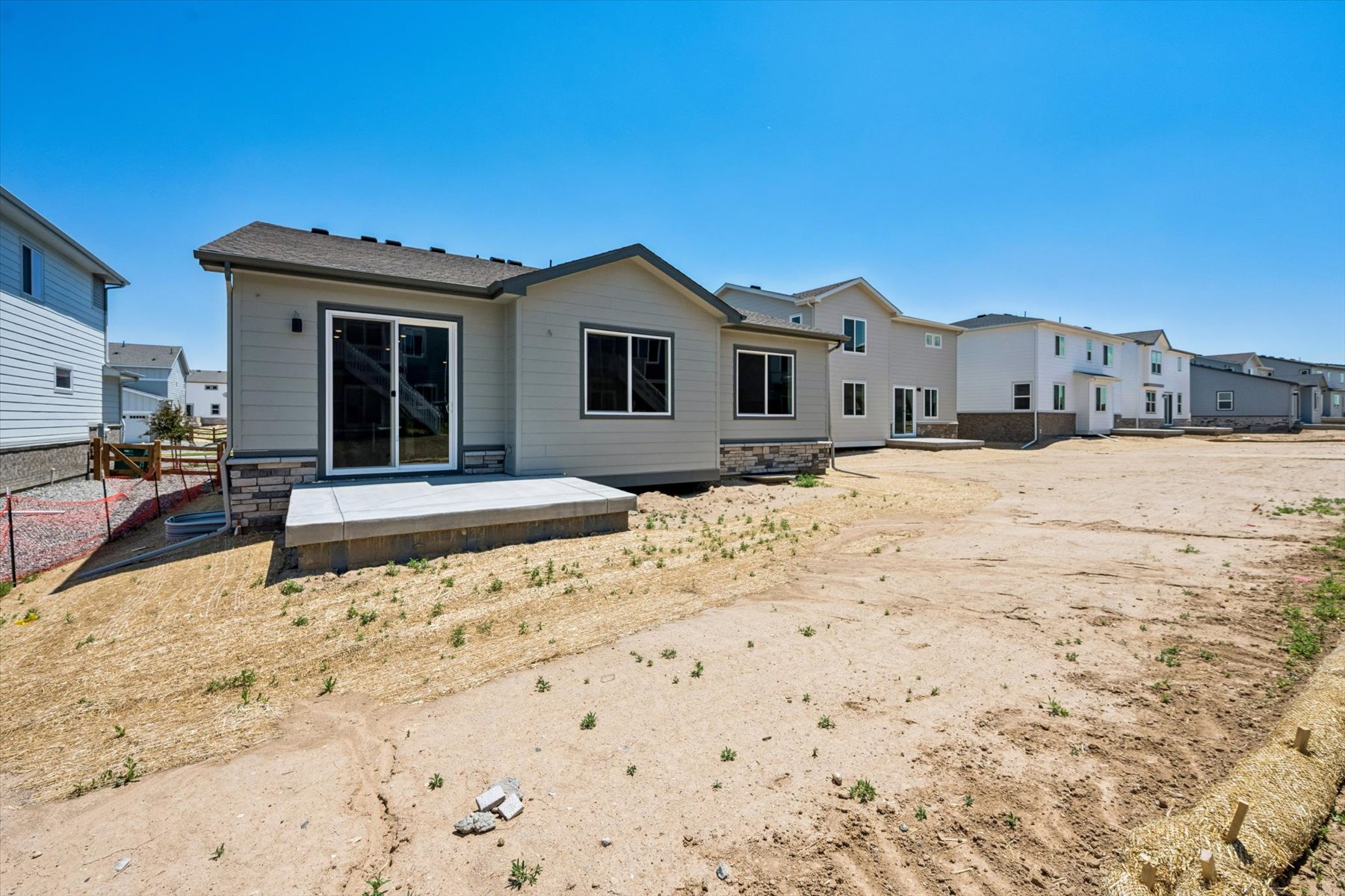 A house with a dirt yard.