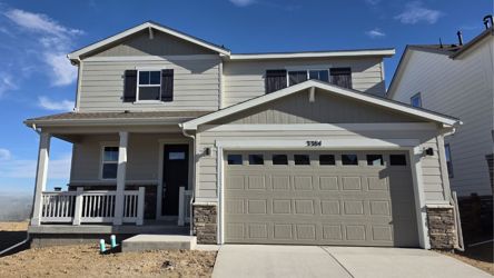 A white house with a garage.