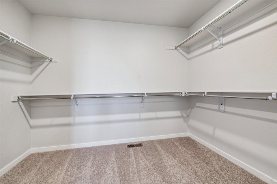 A white room with a metal railing.