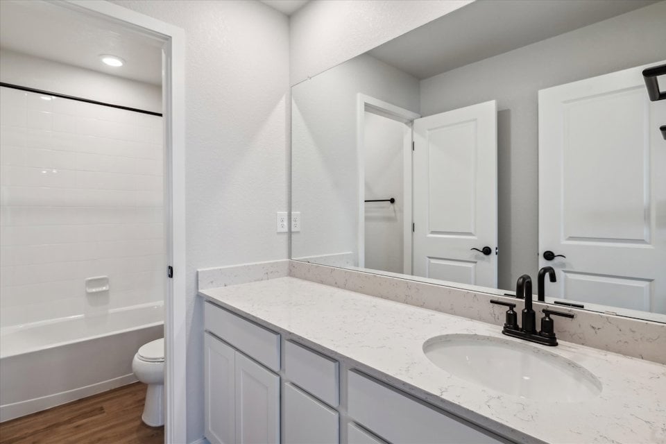 A bathroom with a sink and a toilet.