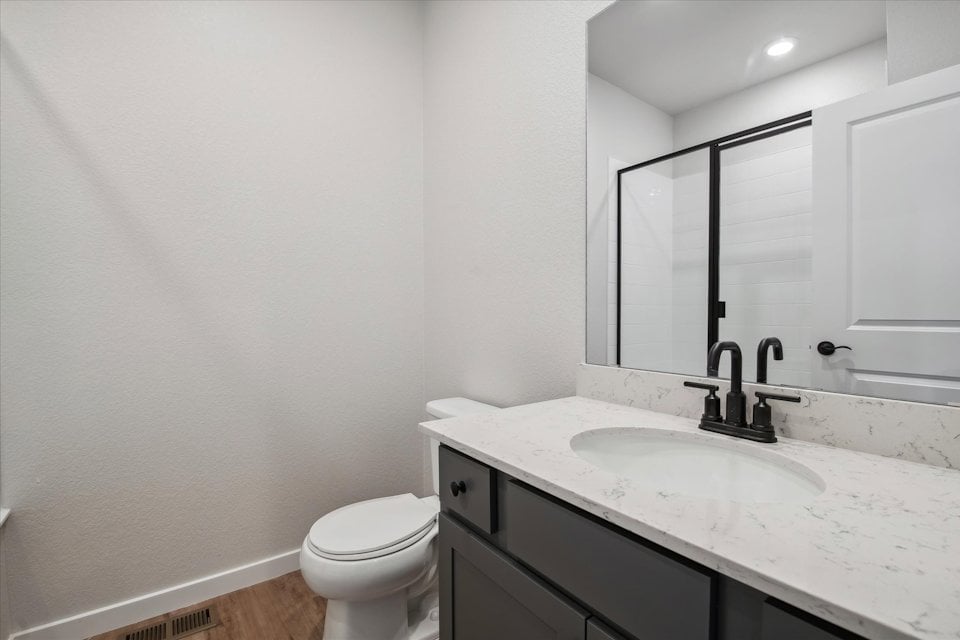 A bathroom with a sink and a toilet.