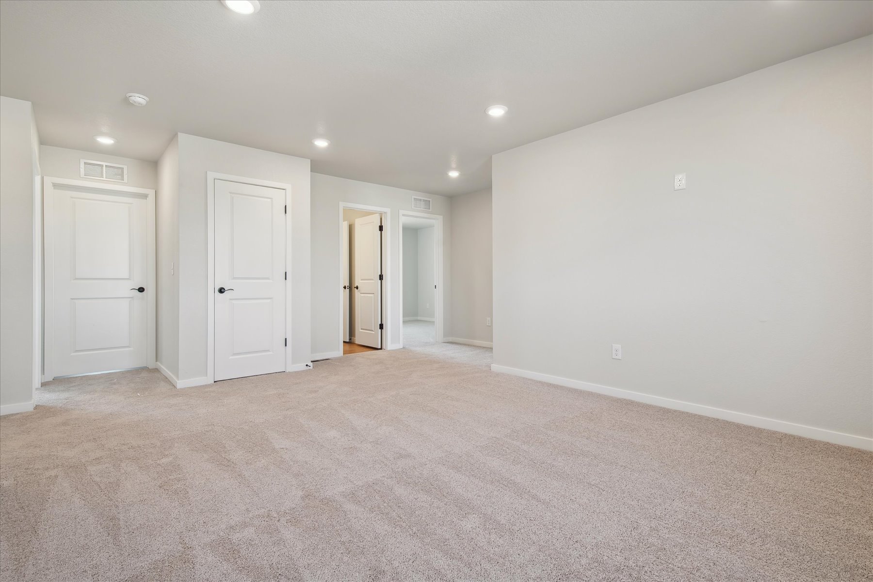 A room with white doors.