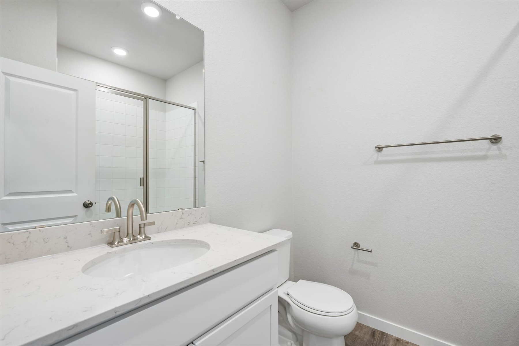 A bathroom with a sink and a toilet.