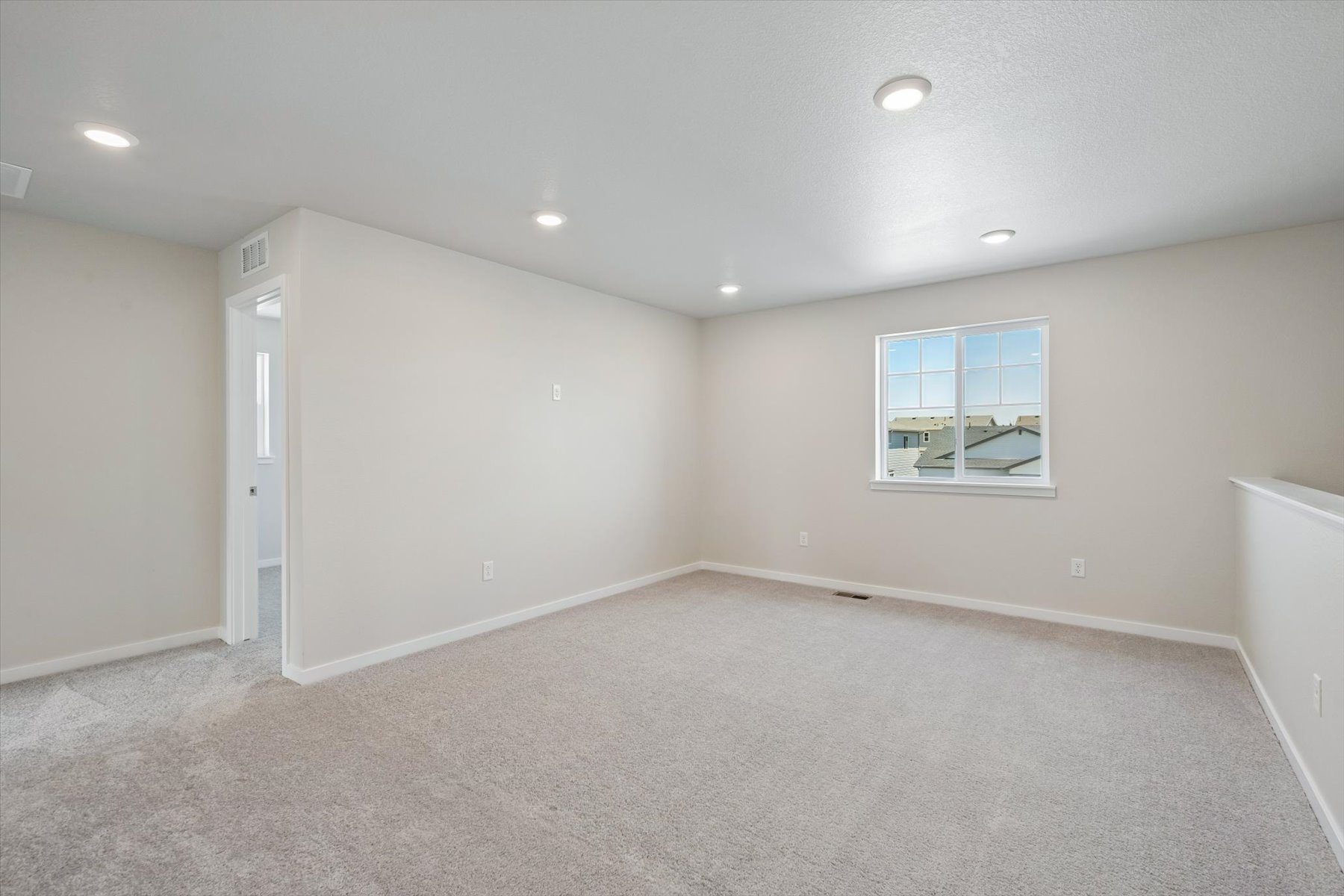 A room with a window and a door.