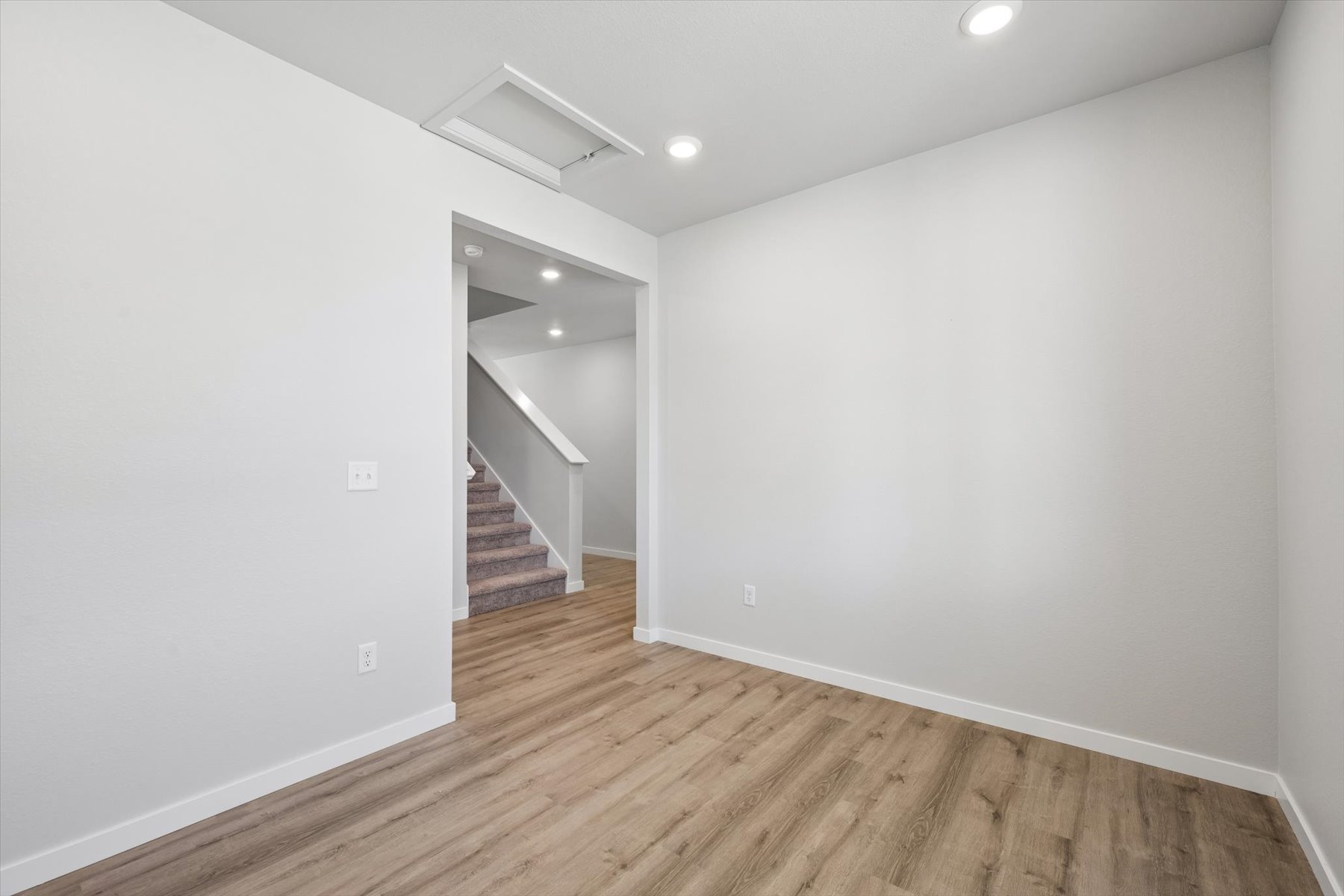A hallway with white walls.