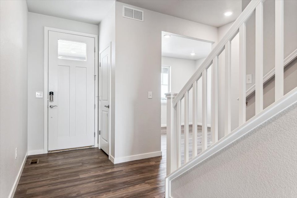A hallway with white doors.