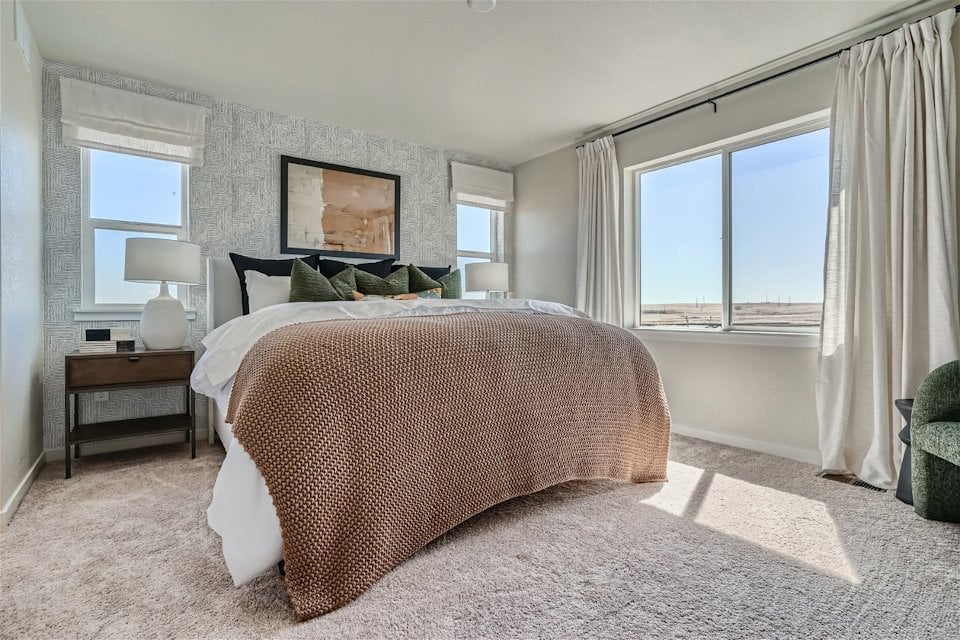 A bedroom with a large bed.