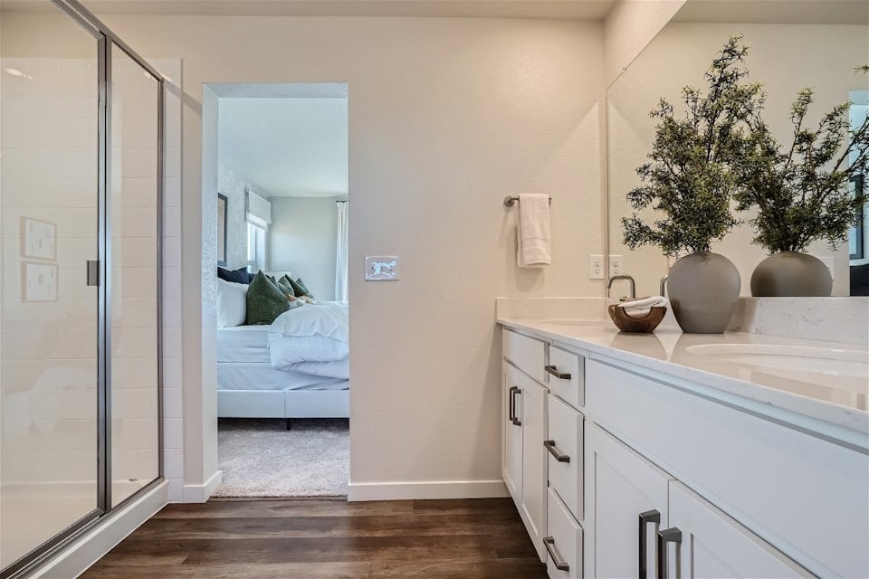 A bathroom with a glass door.
