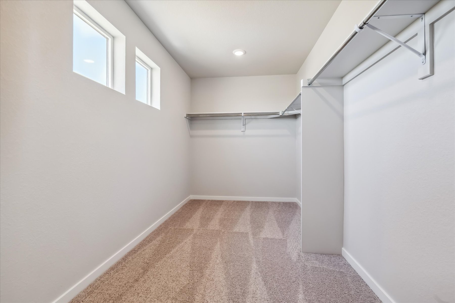 A hallway with white walls.