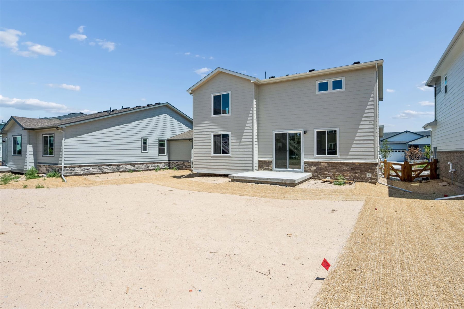 A house with a dirt yard.