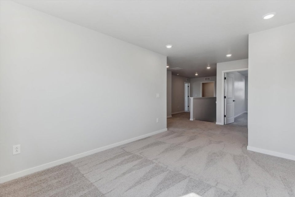 A hallway with white walls.