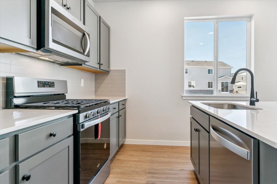 A kitchen with stainless steel appliances.