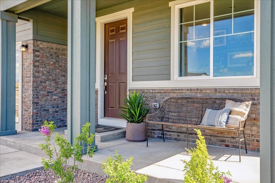 A bench in a backyard.