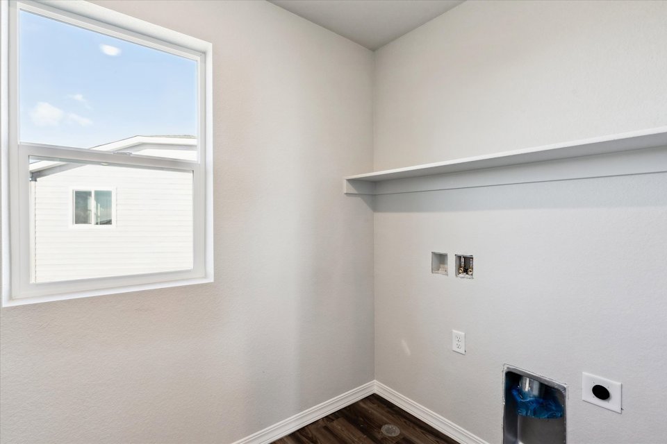 A room with a window and a door.
