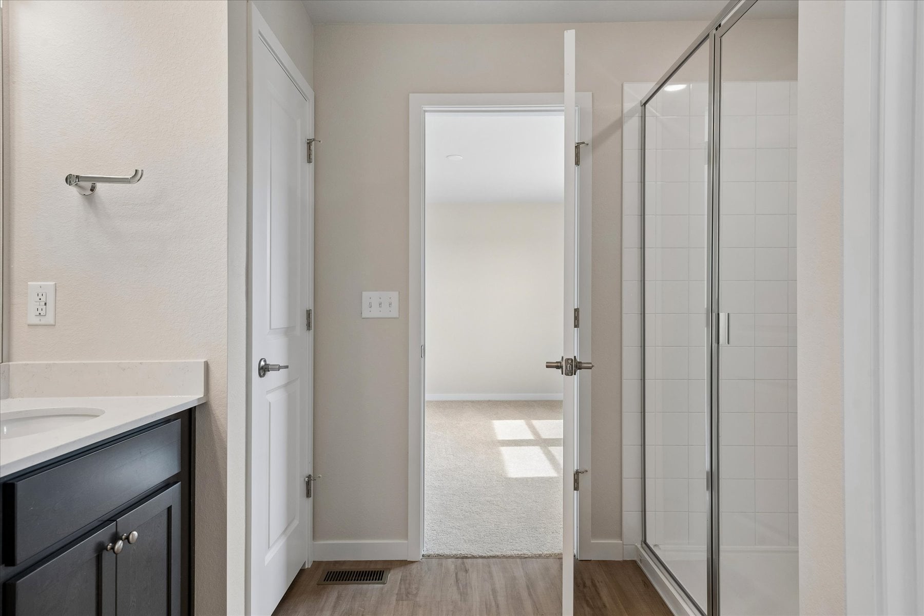 A bathroom with a glass shower.