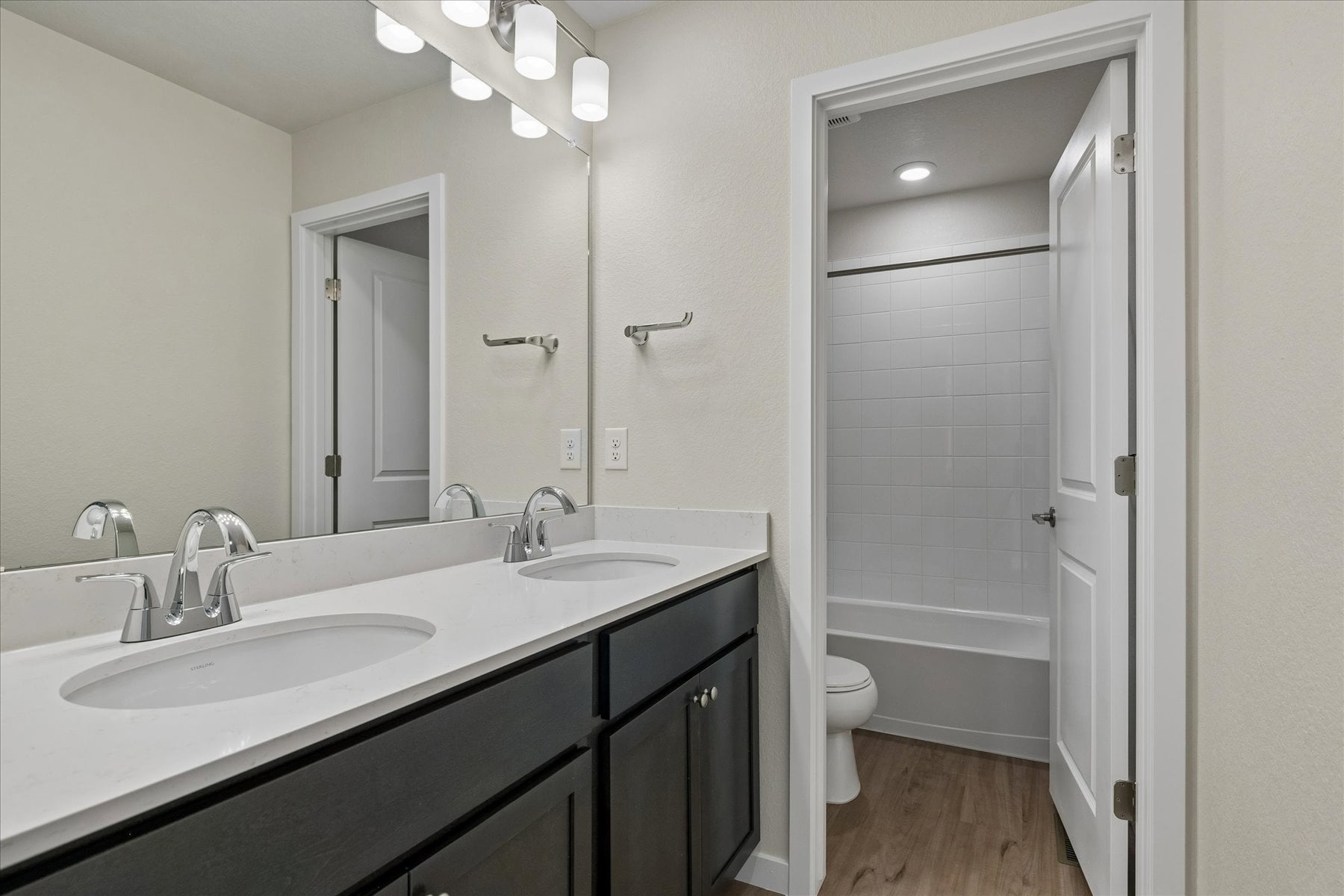 A bathroom with a sink toilet and shower.