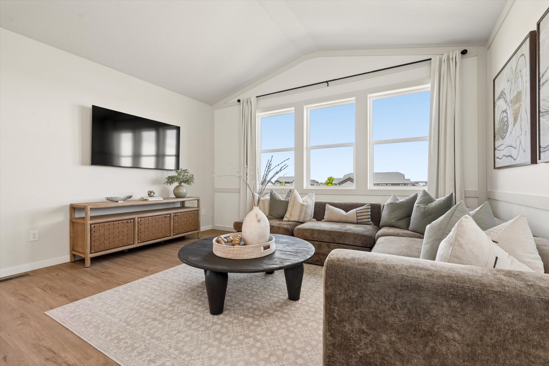 A living room with a large window.