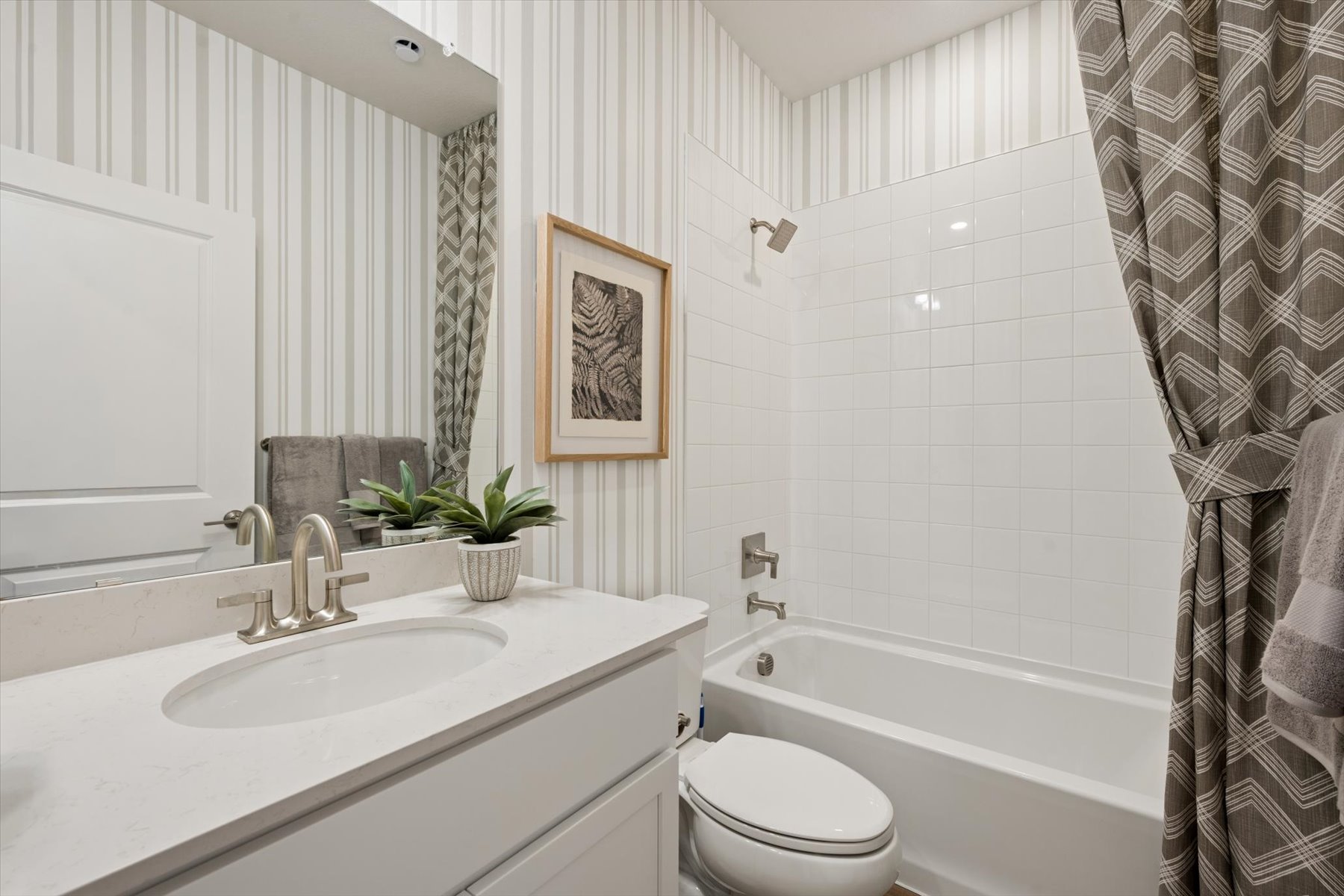 A bathroom with a sink and a toilet.