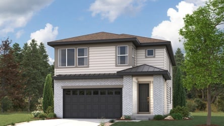 A house with a garage and trees around it.
