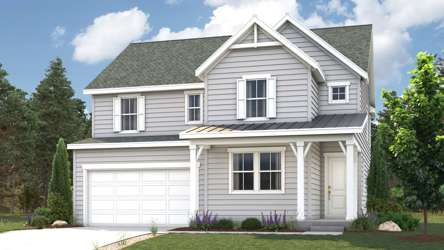 A white house with a garage.