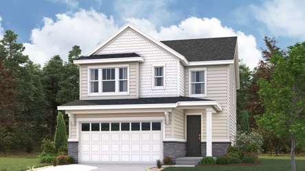 A white house with a driveway.