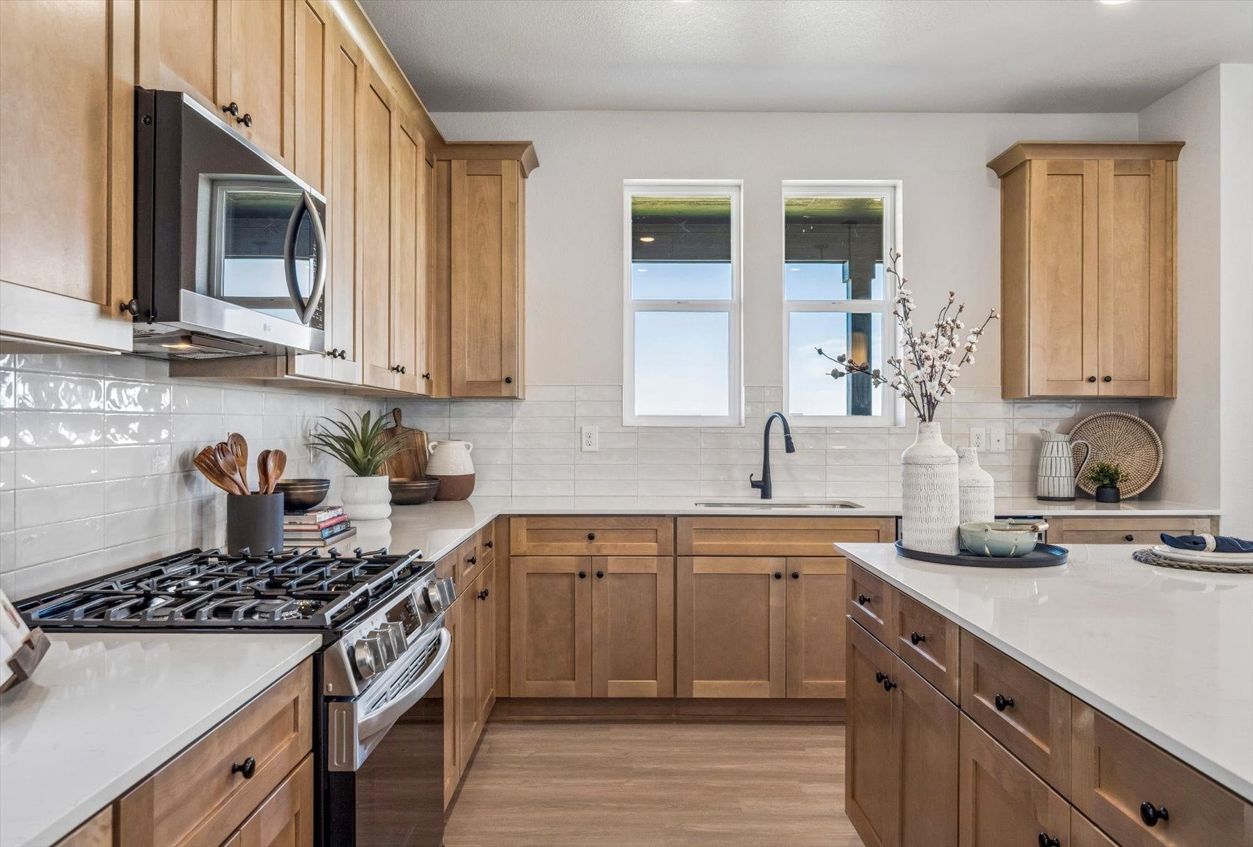 A kitchen with wooden cabinets.