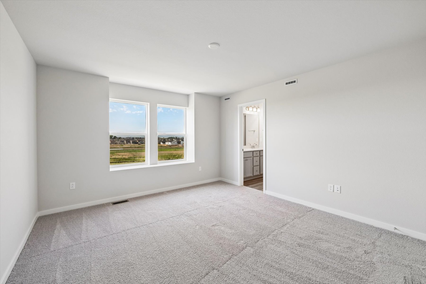 A room with a window and a door.